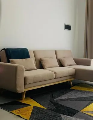 a couch sitting in a living room at NOBRE LUZ T2 Boa Vista in Sal Rei