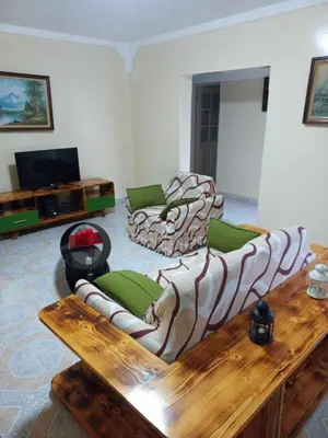 a living room with two couches and a coffee table at Casatata in São Filipe