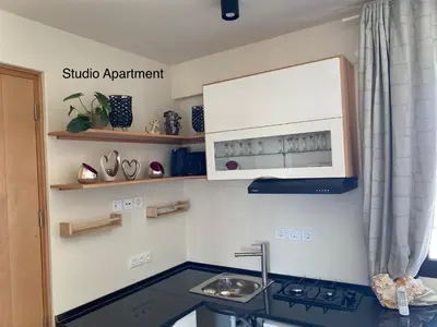 a kitchen with a sink and a microwave at Crown Paradise Beach Lagoon Studio in Sal Rei