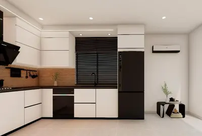 a kitchen with white cabinets and a black refrigerator at Otro Residence in Praia