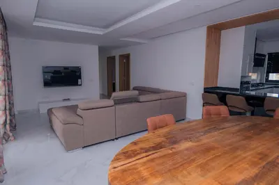 a living room with a table and a couch at Otro Residence in Praia