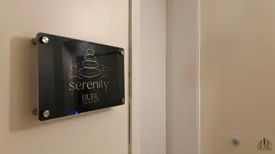a sign on a door that reads security rule at Serenity in Praia