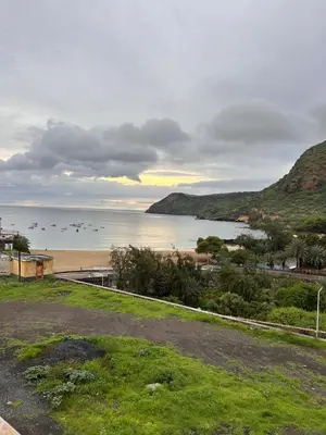 a view of a beach with boats in the water at Sun & Sea Tarrafal in Tarrafal