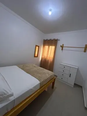 a bedroom with a bed and a dresser in it at Sun & Sea Tarrafal in Tarrafal