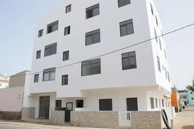 a white building on the side of a street at Sal Casa VILLAGE in Santa Maria