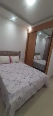 a bedroom with a bed and a large mirror at Lucy aparte in Praia