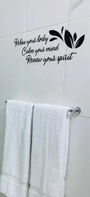 a bathroom with two white towels on a towel rack at Large 1 bedroom Apt with sofa bed in Santa Maria