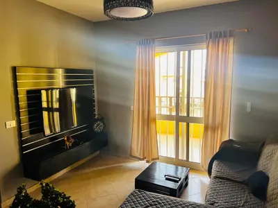 a living room with a couch and a fire place at Santa Maria Central Stay in Santa Maria