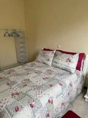 a bedroom with a bed with a quilt on it at Affordable Beach Town Apartment in Santa Maria