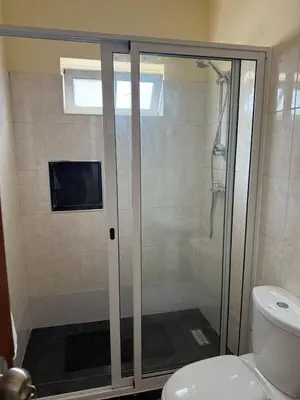 a shower with a glass door in a bathroom at Affordable Beach Town Apartment in Santa Maria