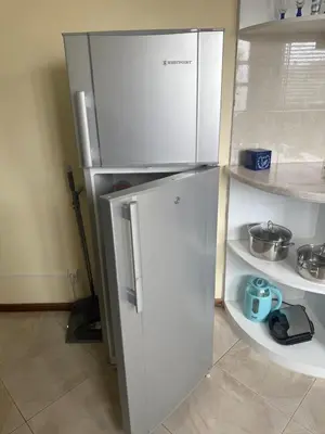 a refrigerator in a kitchen with its door open at Affordable Beach Town Apartment in Santa Maria