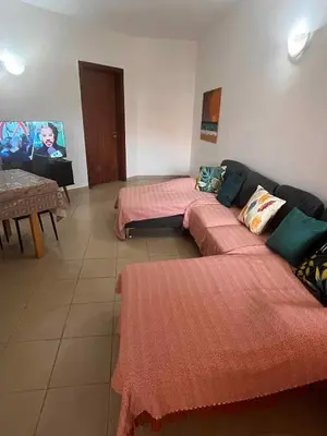 a living room with two beds and a couch at Casa Minuxa in Santa Maria