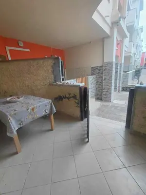 a room with a table and a bench in a building at Casa Minuxa in Santa Maria