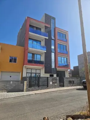 a building on the side of a street at Apartamento Borges in Praia