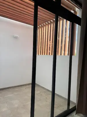 a sliding glass door with a window in a room at Apartamento Cidade in Mindelo