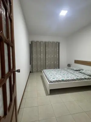 a bedroom with a bed in the corner of a room at Paz, Tranquilidade e Conforto in Espargos