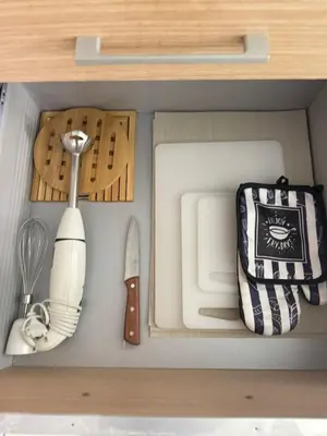 a drawer filled with utensils in a kitchen at Vila Verde Lantana B103 by RPG Group in Santa Maria