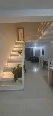 a room with stairs and a living room with a couch at Apartamento Duplex Boa Vista in Sal Rei