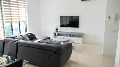 a living room with a couch and a table at Domus Lima in Mindelo