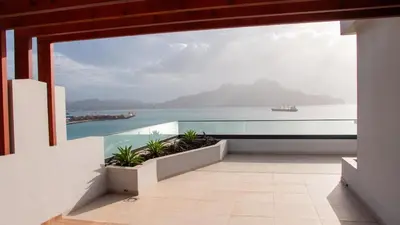 a view of the ocean from the balcony of a house at Domus Lima in Mindelo