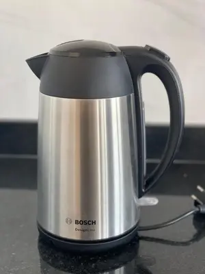 a black and silver tea kettle on a counter at Apartamento T1 - MedSal Residence in Santa Maria
