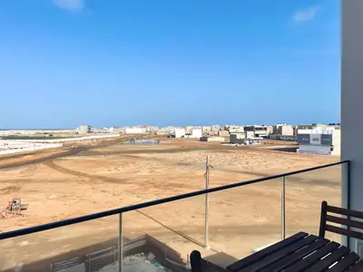 a balcony with a view of a construction site at Apartamento T1 - MedSal Residence in Santa Maria