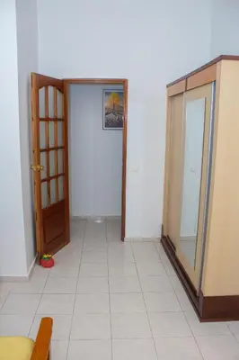 an empty room with a door and a tile floor at T1 Mindelo City Center in Mindelo