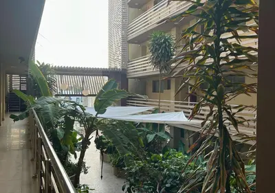 a balcony of a building with plants and a white awning at MonteCara View T1 in Mindelo