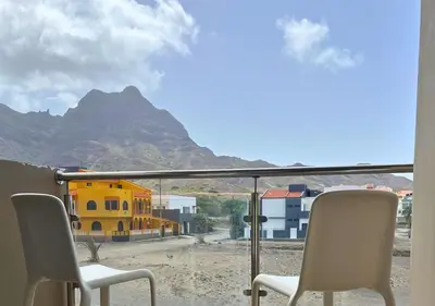 a view of a mountain from a balcony with chairs at MonteCara View T1 in Mindelo
