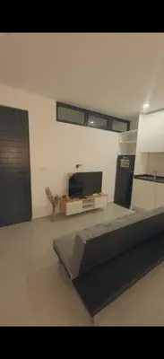 a bedroom with a bed and a tv in it at Castro AP in Mindelo