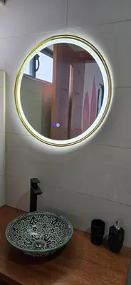 a bowl sitting on a table under a mirror at The Pink Banana in Paul