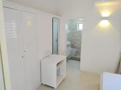 a white bathroom with a sink and a toilet at Lamore 01 - more comfortable of all in Beirona