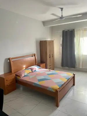 a bedroom with a bed and a dresser in it at T0 Brisa Tropical in Sal Rei