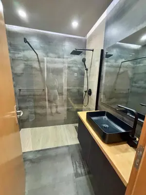 a bathroom with a shower and a sink at Empire Home! in Praia