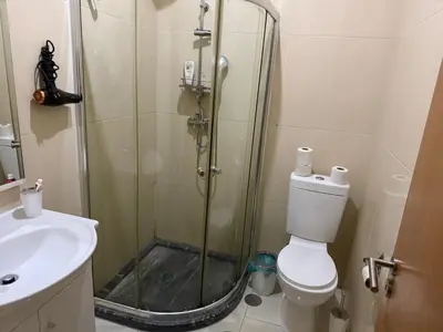 a bathroom with a shower and a toilet and a sink at vitoria in Praia