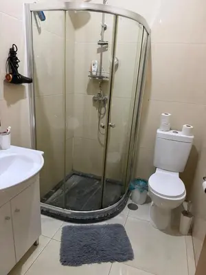 a bathroom with a shower with a toilet and a sink at vitoria in Praia