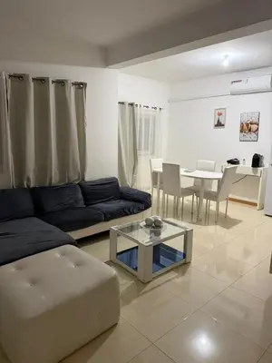 a living room with a couch and a table at vitoria in Praia