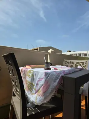 a table with a table cloth on it on a balcony at Soul of Sal in Santa Maria
