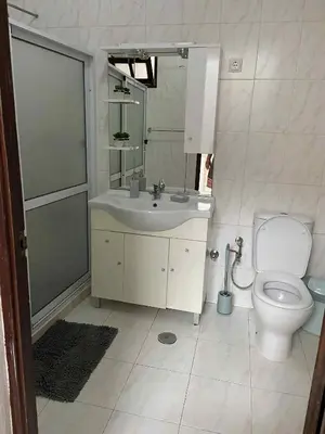 a bathroom with a sink and a toilet at MONTROND House in São Filipe