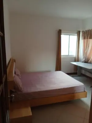a bedroom with a bed and a window in a room at Gada House in Sal Rei