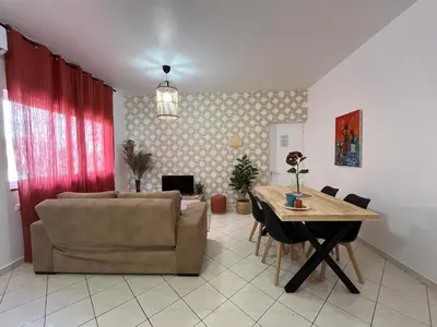 a living room with a couch and a table at Isabel s Bay in Santa Maria