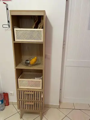 a wooden book shelf with a banana in it at Isabel s Bay in Santa Maria