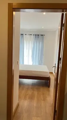 a bedroom with a bed and a window at Elson Apartment - T1 - Cidadela - Security, Comfort in Praia