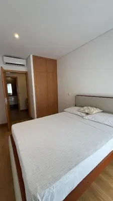a bedroom with a large white bed in it at Elson Apartment - T1 - Cidadela - Security, Comfort in Praia