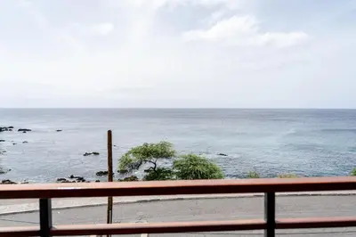 a view of the ocean from a balcony at o som das ondas in Praia