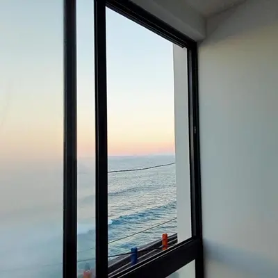 a window with a view of the ocean at Casa Nova in Ribeira Grande
