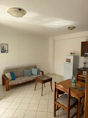 a living room with a couch and a table at Murdeira V159D Duplex by RPG Group in Beirona