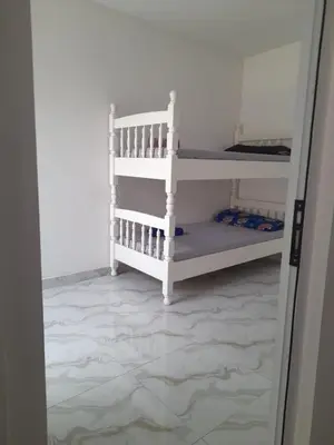 a room with two bunk beds in a room at Sal Blue Apartment in Santa Maria