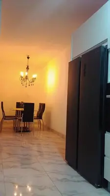 a dining room with a table and a chandelier at Sal Blue Apartment in Santa Maria