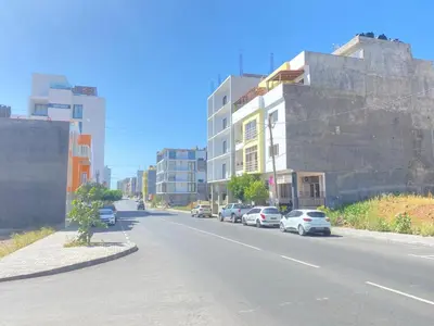 a street with cars parked on the side of the road at Guest house B&S in Praia